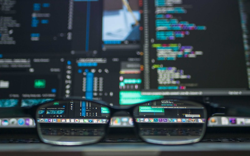 Developer workspace with AI coding assistant helping debug a complex application